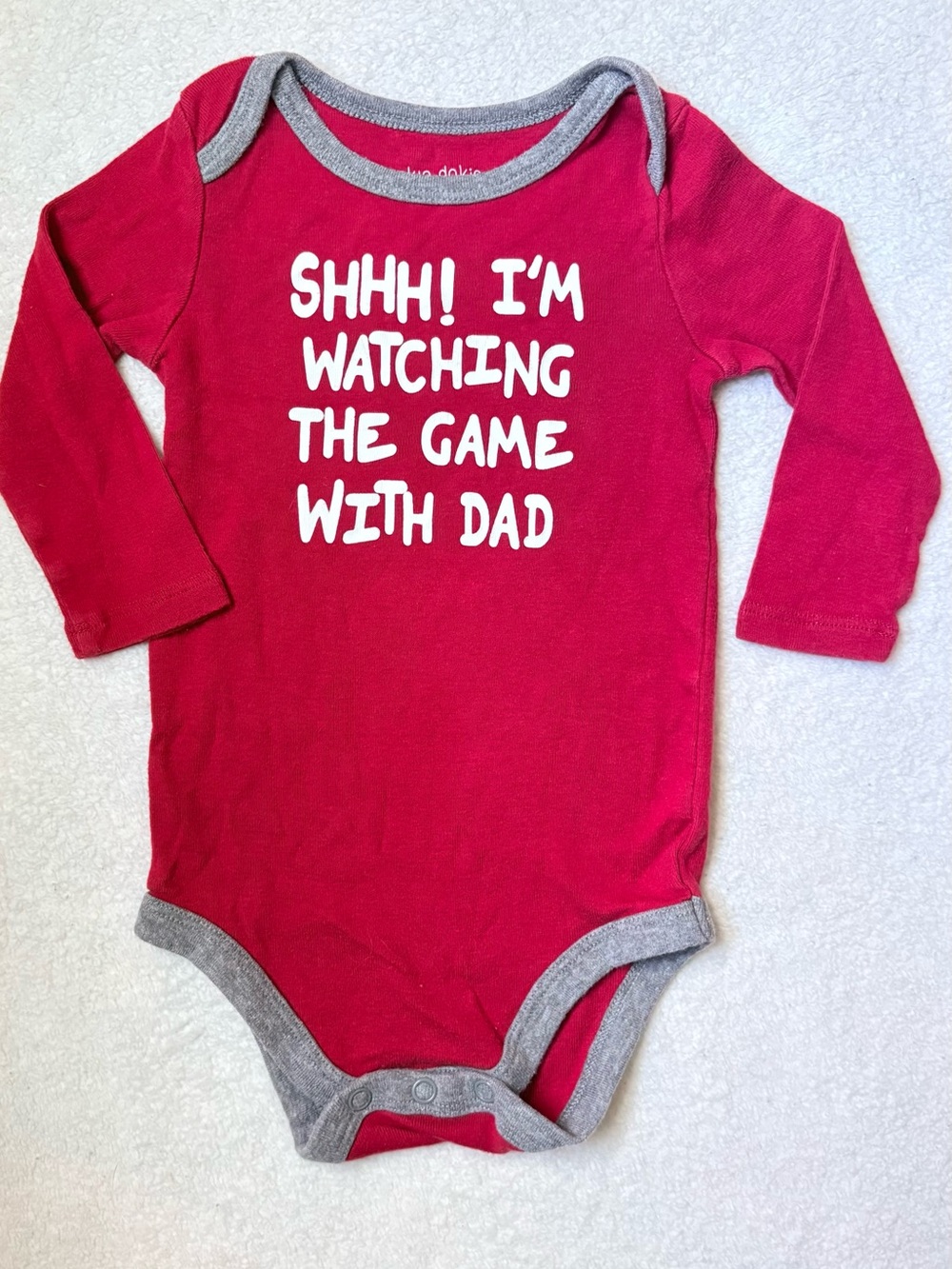 Red Baby One-Piece Bodysuit with 'Watching the Game' Graphic